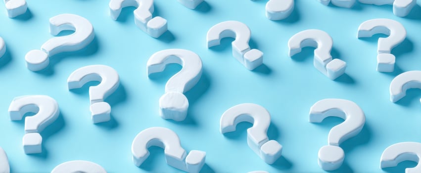 The white question marks on a vibrant blue background evoke curiosity and inquiry photo