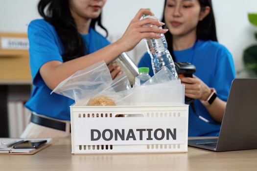 Volunteers sorting donations, preparing for community outreach photo