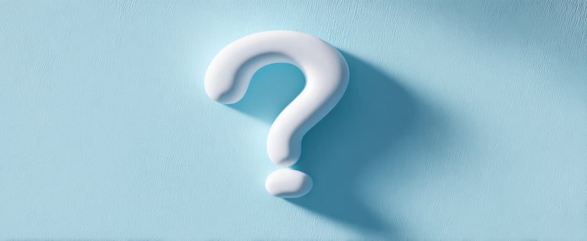 The Question Mark on a Soft Blue Background Conveying Curiosity and Inquiry photo