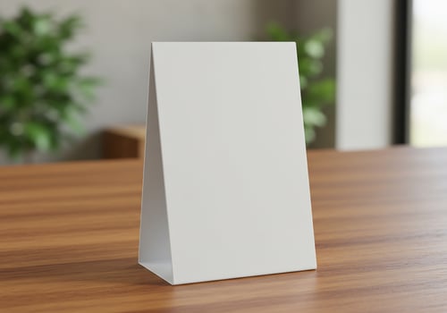 Blank menu on wood counter, green plants in restaurant as backdrop for promotion photo