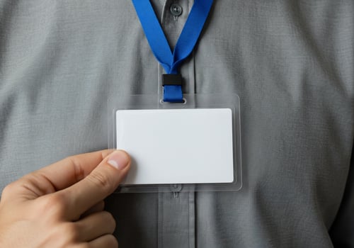 Close-up of blank ID card held by person, on shirt, for business meetings photo
