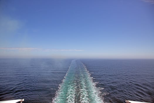 Ship wake from cruise deck over open Baltic Sea photo