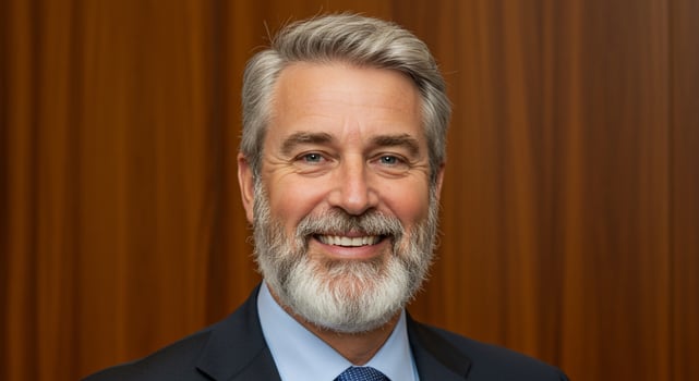 A man with a beard and a blue tie photo