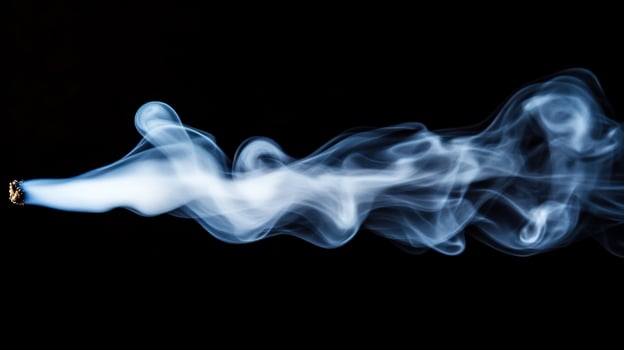 Abstract smoke plume against black background photo