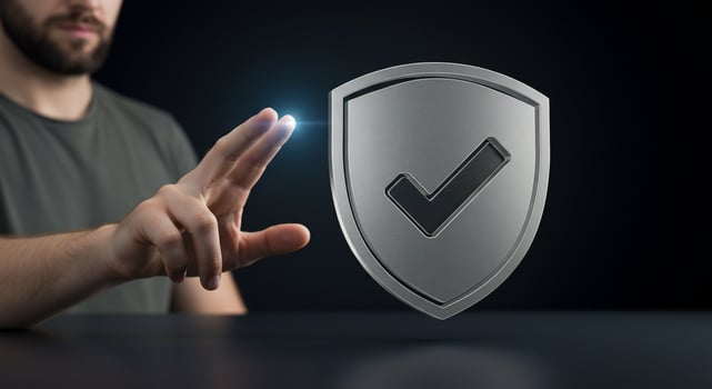 A man is touching a shield with a check mark photo