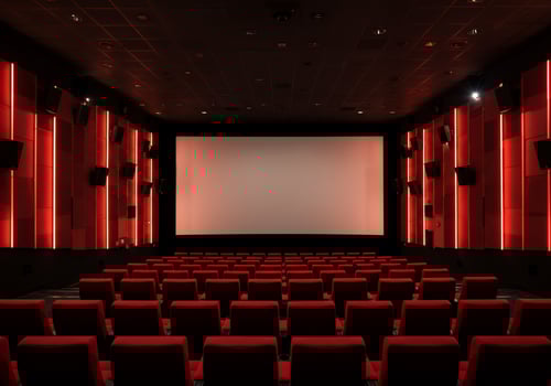 Empty cinema auditorium with red seats before a movie, for entertainment ads photo