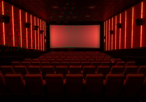 A theater with red lights and empty seats photo