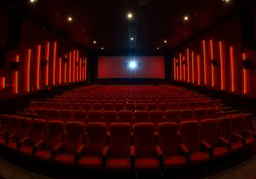 Empty red movie theater seats ready for showing new film. Industry use photo