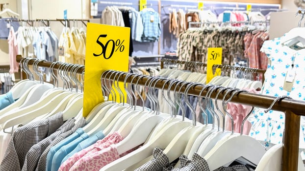 50 percent off sale sign in a children's store photo