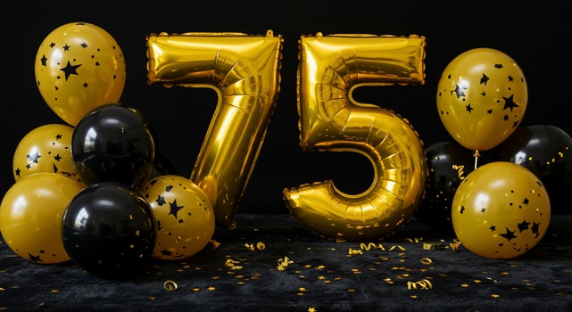 Golden balloons and number 75 with confetti on black background photo