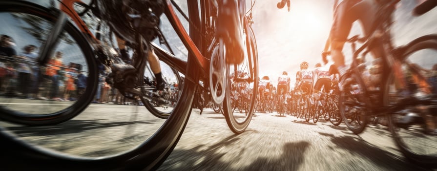 The cyclists racing towards victory in a vibrant outdoor event. photo