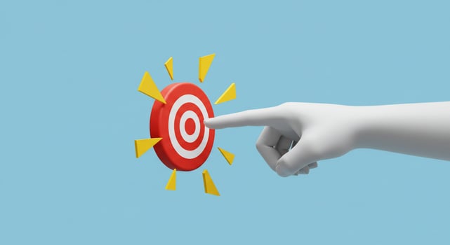 A hand pointing at a target with a sun in the center photo