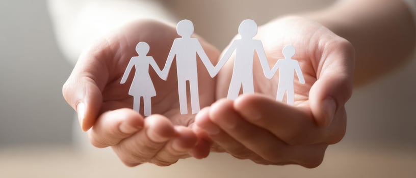 The Hands Holding Paper Family Figures Representing Love and Togetherness photo