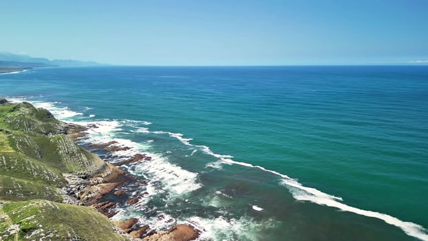 Stunning Aerial Views of the Serene Coastline and Lush Green Hills Captivating Nature photo