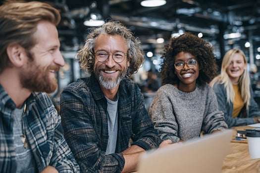 Smiling creative team enjoying working together in modern office photo