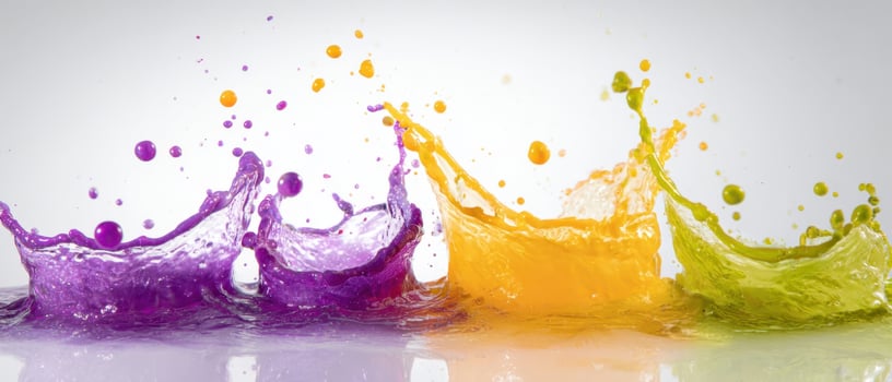 The vibrant splash of colorful liquid creating dynamic water shapes. photo