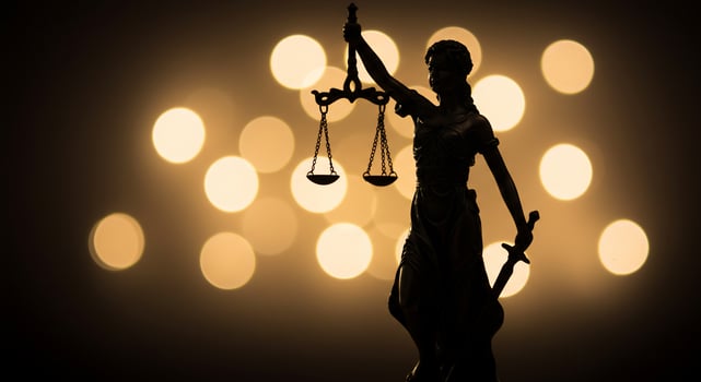 A statue of lady justice holding a scale of justice photo