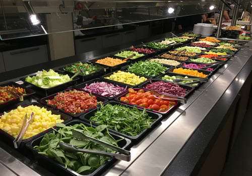 Large buffet line with fresh salad bar, food variety, nutrition background use photo