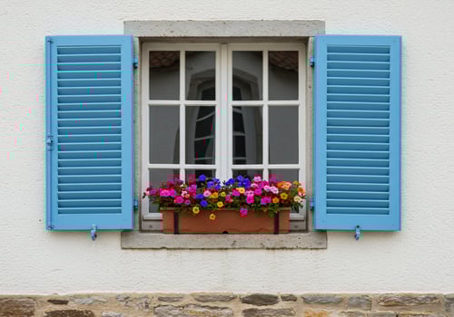A window with blue shutters photo