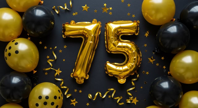 Golden balloons and black balloons with the number 75 photo