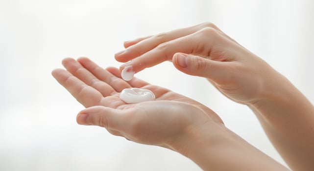 Soft Hands Applying Moisturizing Cream for Skin Care photo