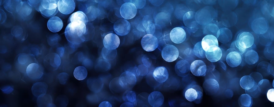 The blue bokeh background with shimmering lights creating an ethereal atmosphere. photo