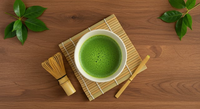 Matcha green tea with bamboo mat and chopsticks photo