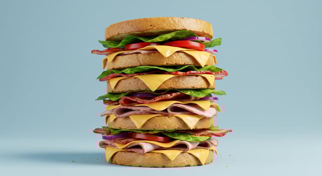 Towering Multi-Layered Sandwich on a Blue Background photo