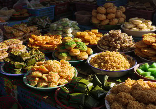 Traditional Indonesian Snacks Displayed at Outdoor Market for Selling and Consumption photo