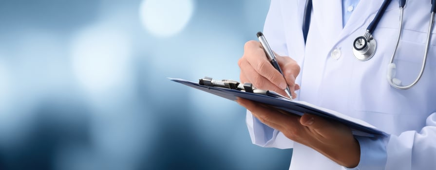 The doctor writing notes on a clipboard in a healthcare setting. photo