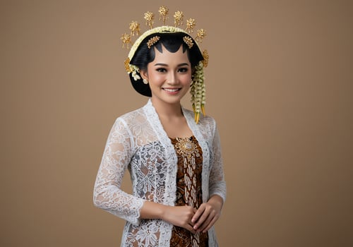 A woman in traditional dress posing for a photo