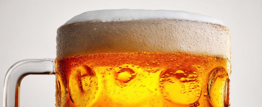 The frothy mug of beer celebrates refreshing moments of enjoyment. photo