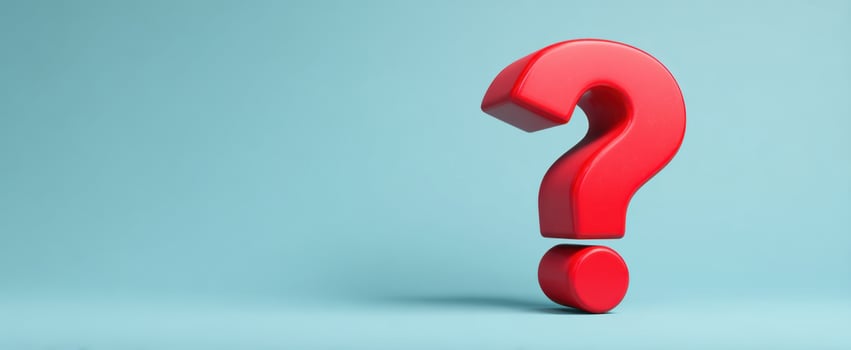 The Red Question Mark Standing Boldly Against a Soft Blue Background photo