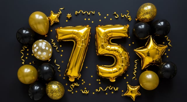 Golden balloons and confetti for the number 75 photo