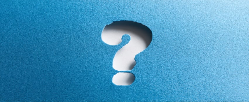 The Question Mark Cutout on a Smooth Blue Background photo