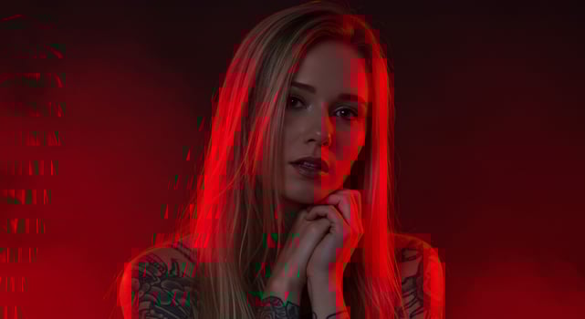 Attractive Woman Posing in a Studio with Red Moody Lighting photo