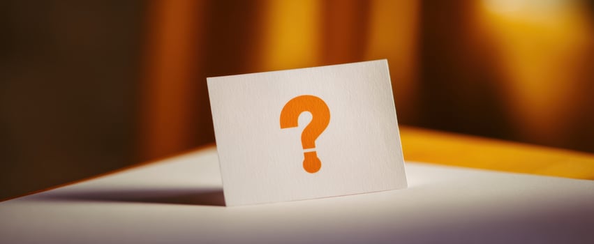The question mark on a card inviting thoughts and reflections. photo