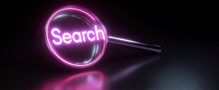 The Neon Magnifying Glass Highlighting Search in a Dark Background photo