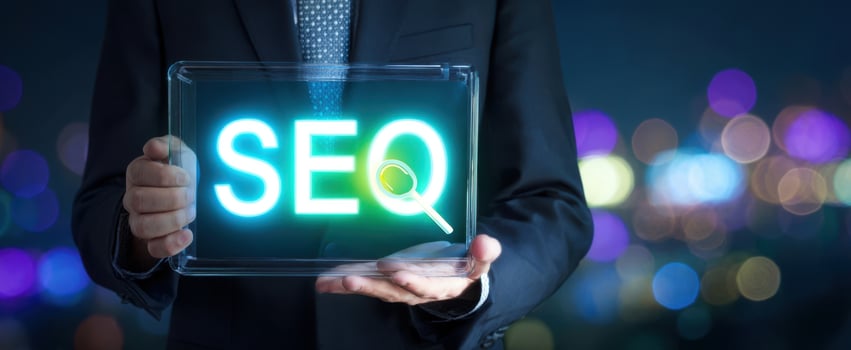 The Businessman Holding a Transparent Sign Featuring SEO Keywords at Night photo
