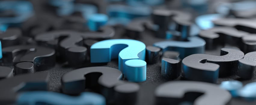 The Blue Question Mark Among Black Symbols Representing Inquiry and Curiosity photo