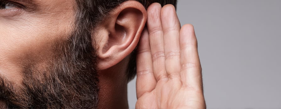 The attentive man listening closely with a thoughtful expression on his face. photo