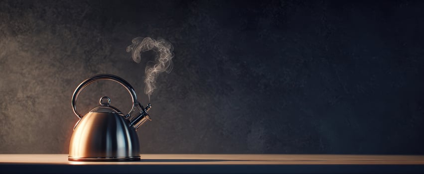 The kettle releasing steam against a dark background creating a cozy ambiance. photo