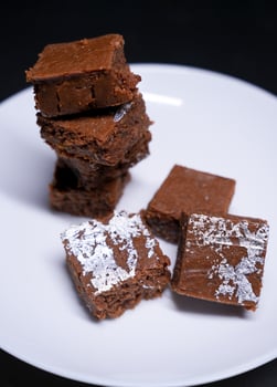 Chocolate Barfi white plated in perfect cubes with dark cocoa glaze photo