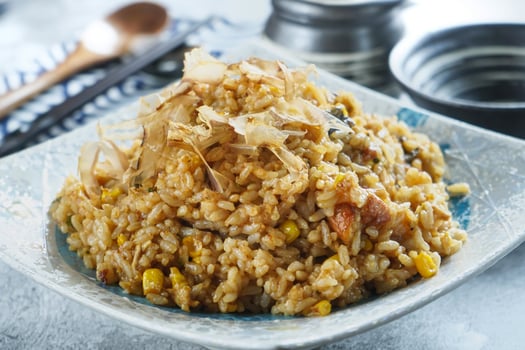 Eel Fried Rice with Bonito Flakes in plate closeup side view of Japanese Cuisine and Main Course photo