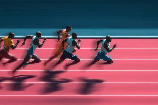 A group of athletes running on a track photo