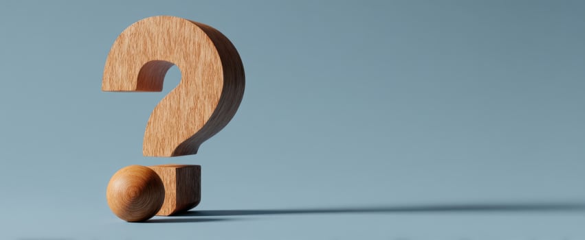 The wooden question mark symbolizing curiosity and inquiry in a minimalistic setting. photo
