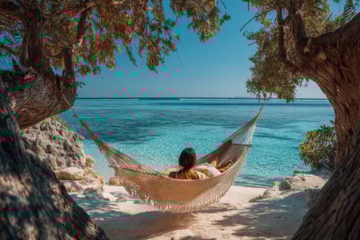 A woman in a hammock on the beach photo