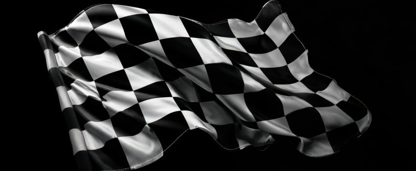 The dynamic checkered flag waving against a dark background showcasing victory. photo