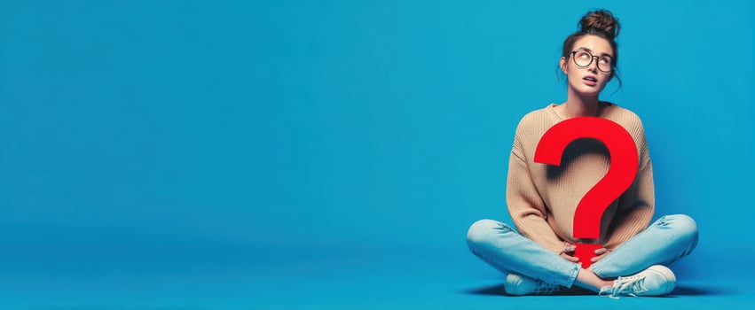 The thoughtful woman contemplating life with a large question mark. photo