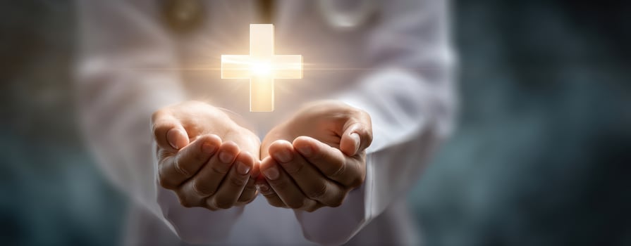The Hands of Care Holding a Glowing Cross of Healing and Hope photo